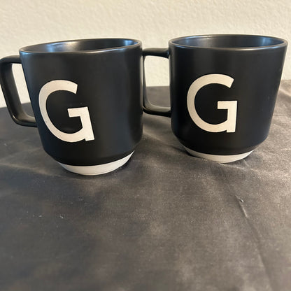 Mugs Black w/  monogram “G” in white set of 2