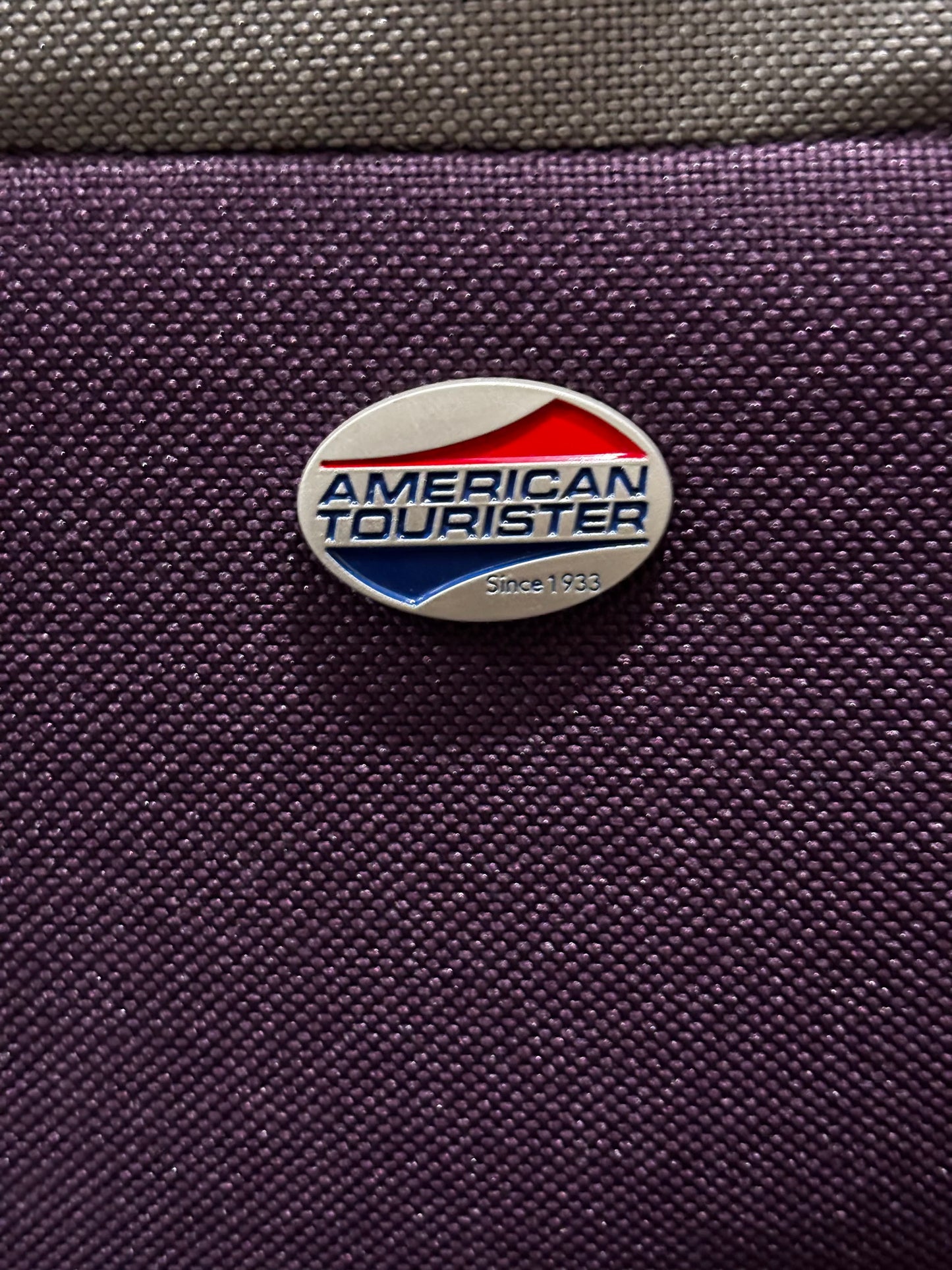 American Tourister Purple Carry-on Travel bag