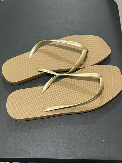 Tan and Gold Women’s flip-flops size 10