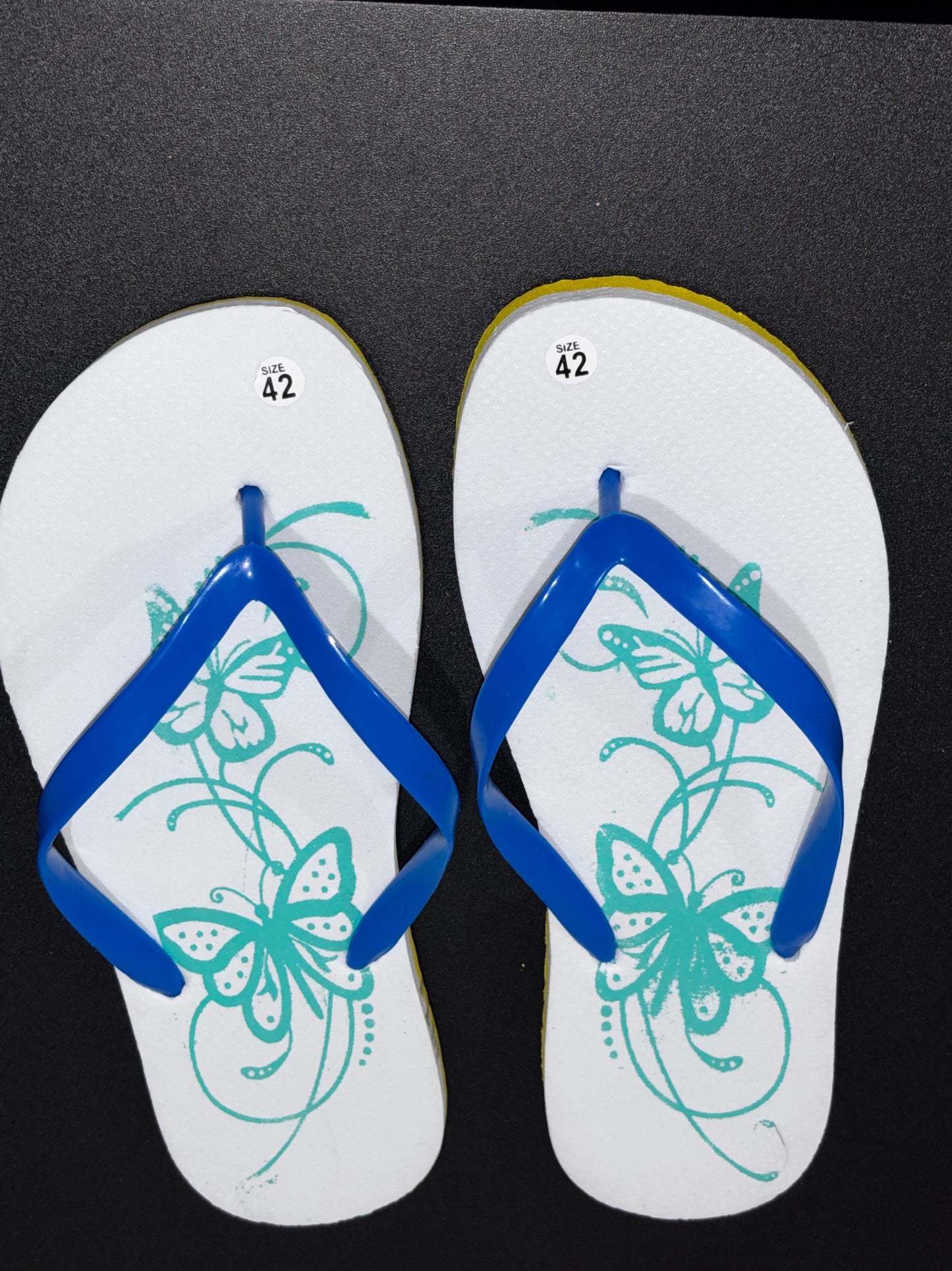 White Blue Flip Flops with Butterfly design size 42. (10/10.5)